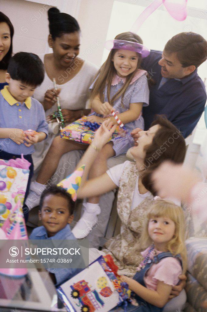 Stock Photo: 1574R-03869 Group of children and their parents at a birthday party
