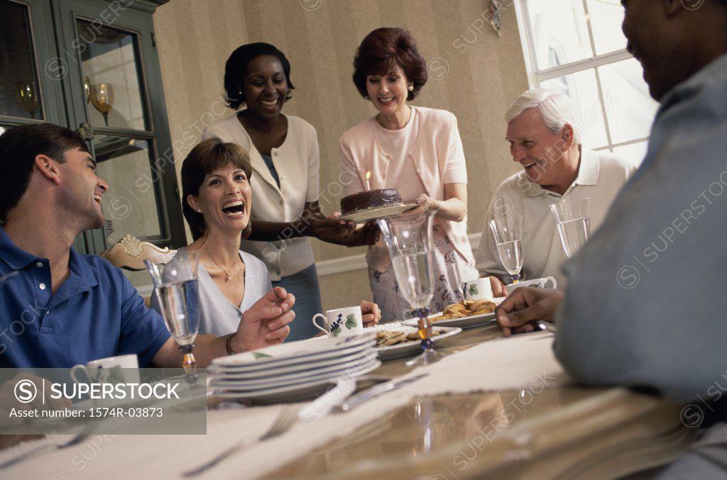 Stock Photo: 1574R-03873 Group of people celebrating a dinner party