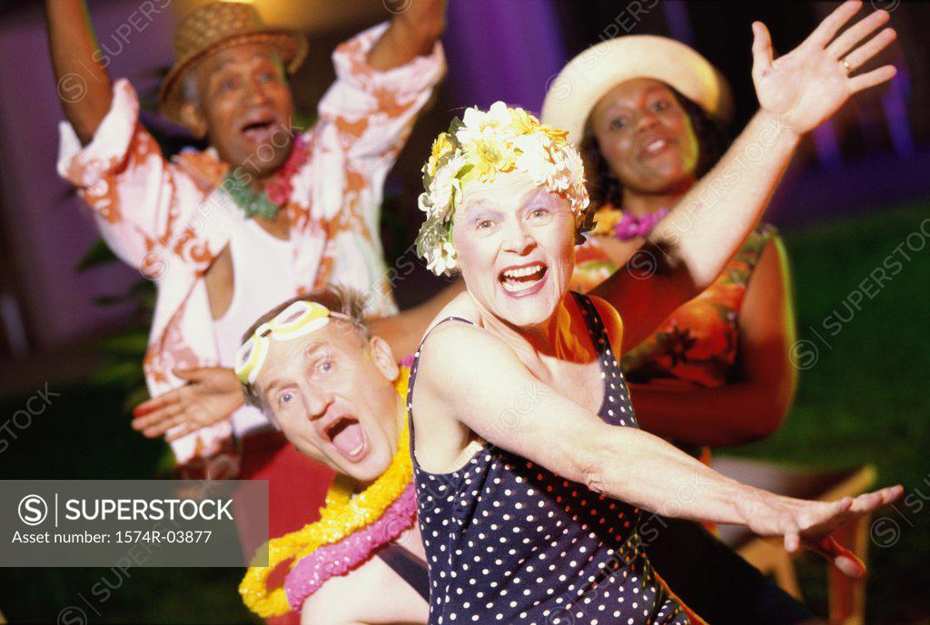 Stock Photo: 1574R-03877 Portrait of two senior couples dancing at a party