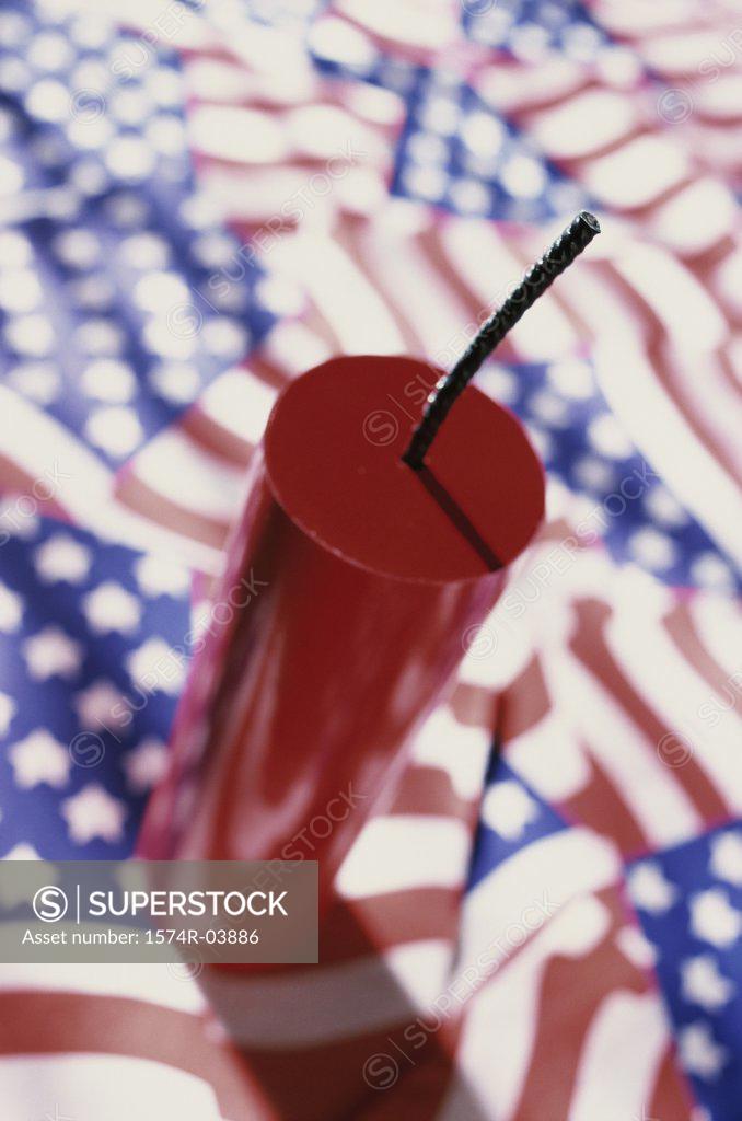 Stock Photo: 1574R-03886 Close-up of a firecracker on American flags