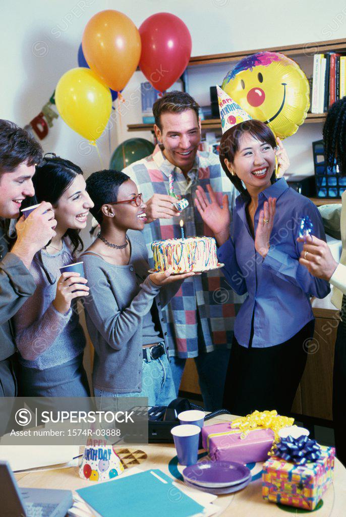 Stock Photo: 1574R-03888 Group of business executives celebrating a birthday in the office