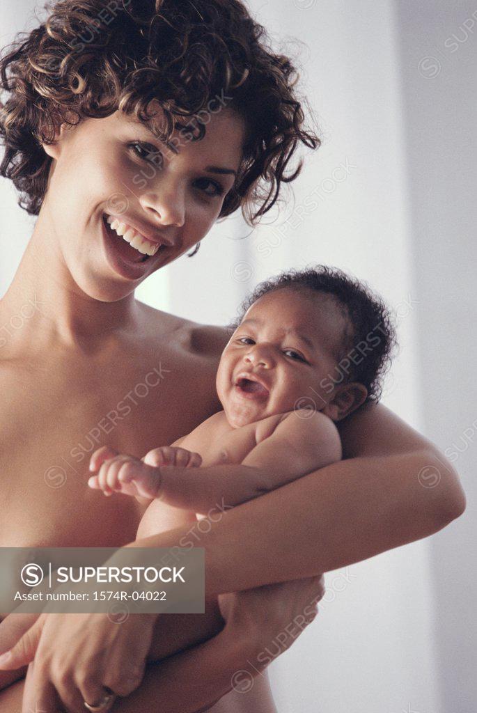 Stock Photo: 1574R-04022 Portrait of a mother carrying her baby boy