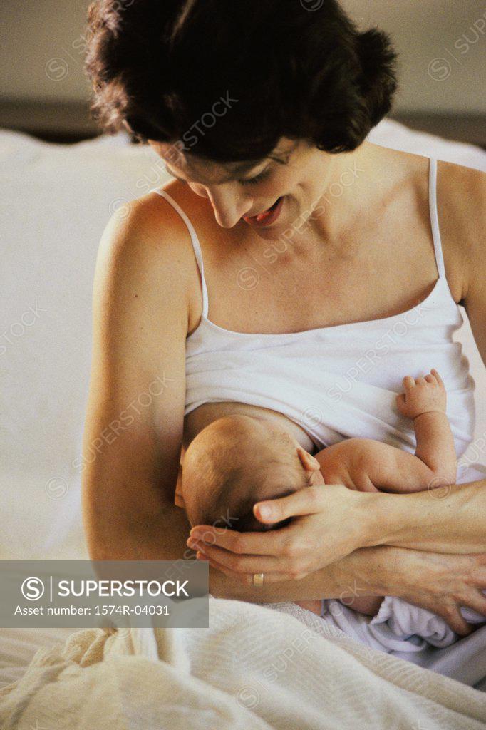 Stock Photo: 1574R-04031 Mother breastfeeding her baby boy