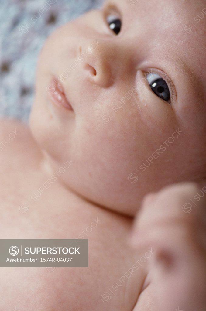 Stock Photo: 1574R-04037 Portrait of a baby boy lying down