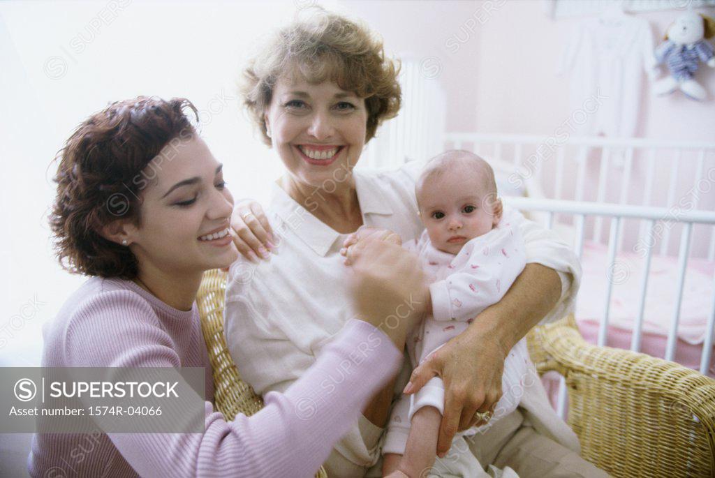 Stock Photo: 1574R-04066 Portrait of a grandmother holding her granddaughter