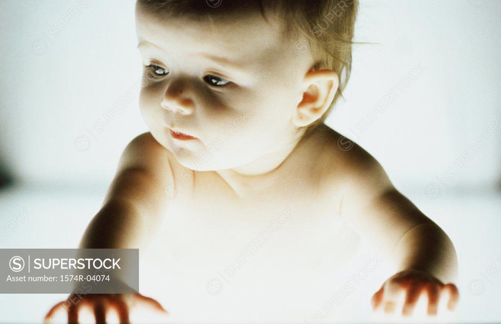 Stock Photo: 1574R-04074 Close-up of a baby boy looking sideways