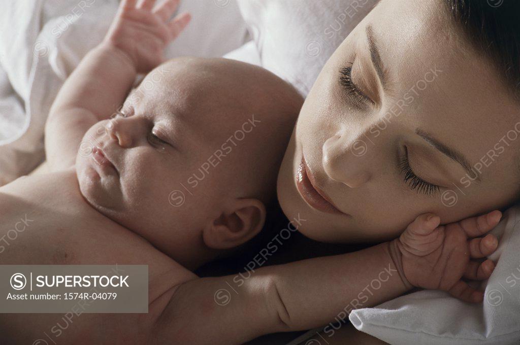 Stock Photo: 1574R-04079 Close-up of a mother and her baby boy sleeping