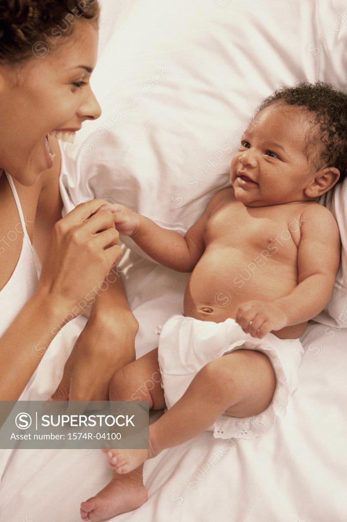 Stock Photo: 1574R-04100 Mother touching her baby boy