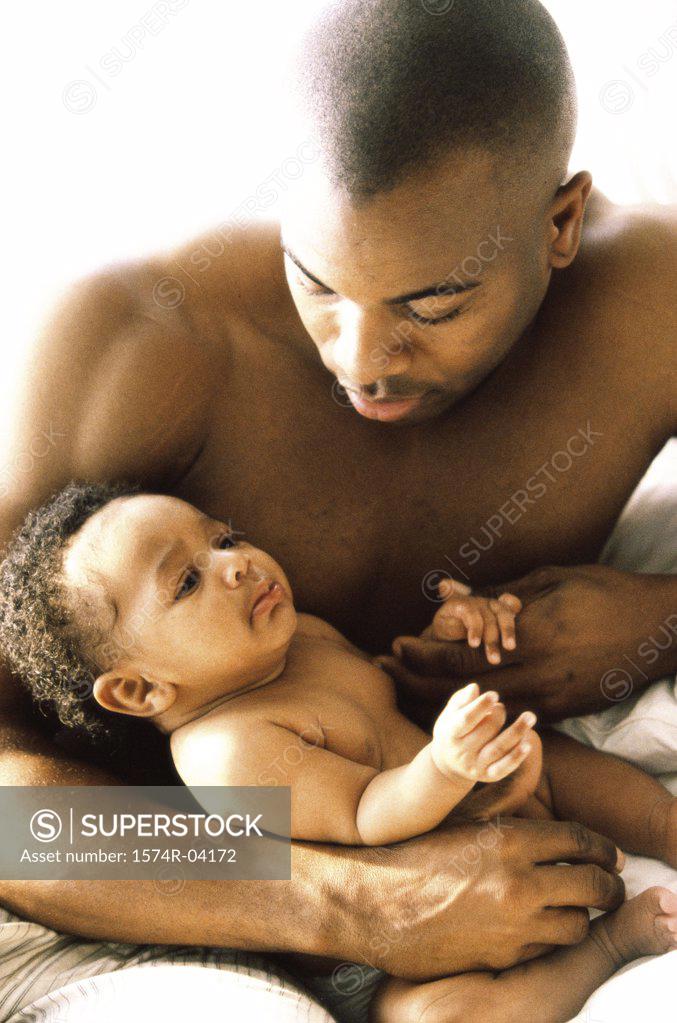 Stock Photo: 1574R-04172 Close-up of a father holding his baby boy
