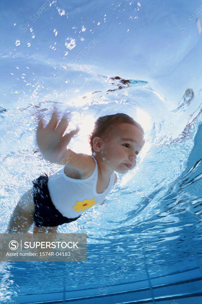 Stock Photo: 1574R-04183 Girl swimming underwater