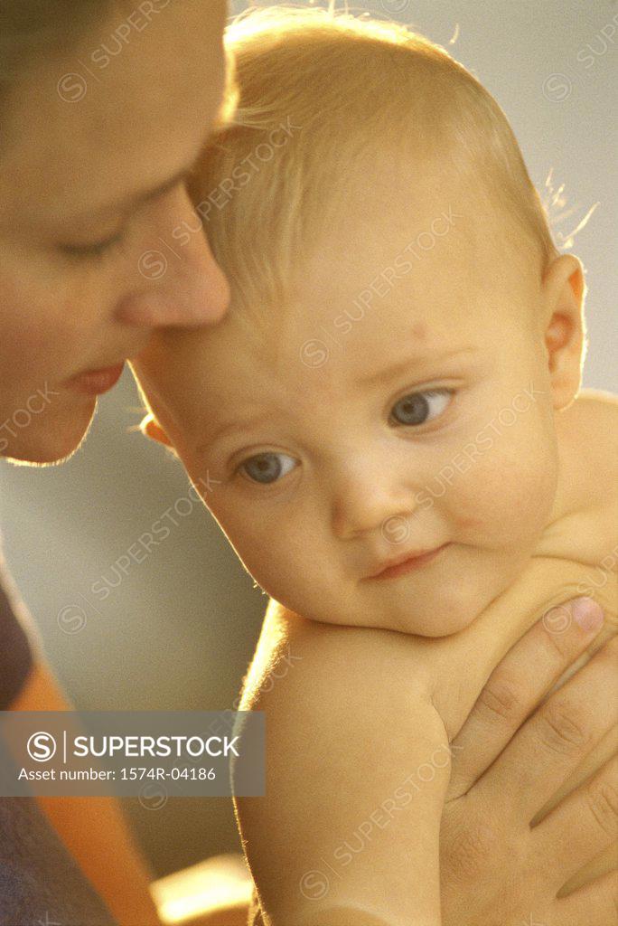 Stock Photo: 1574R-04186 Close-up of mother holding her baby boy