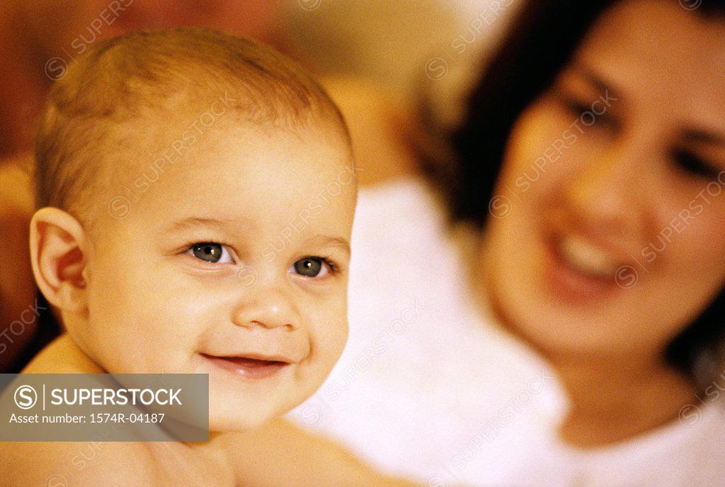 Stock Photo: 1574R-04187 Mother looking at her baby girl smiling
