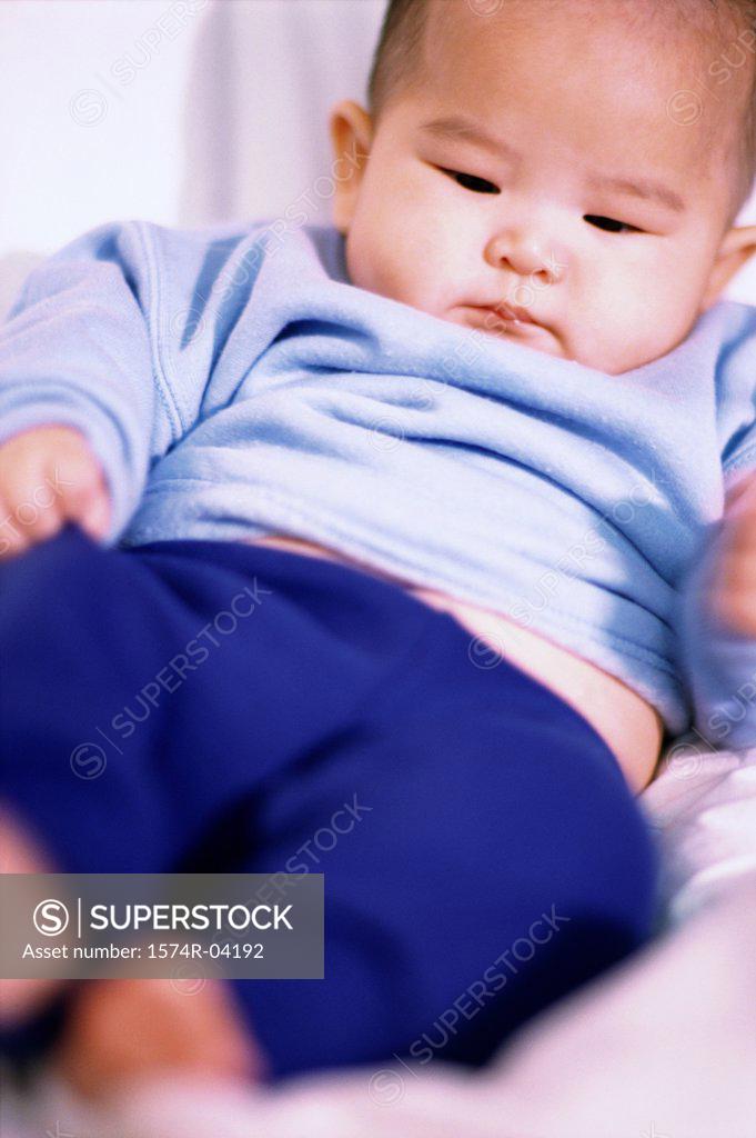 Stock Photo: 1574R-04192 Person holding a baby boy