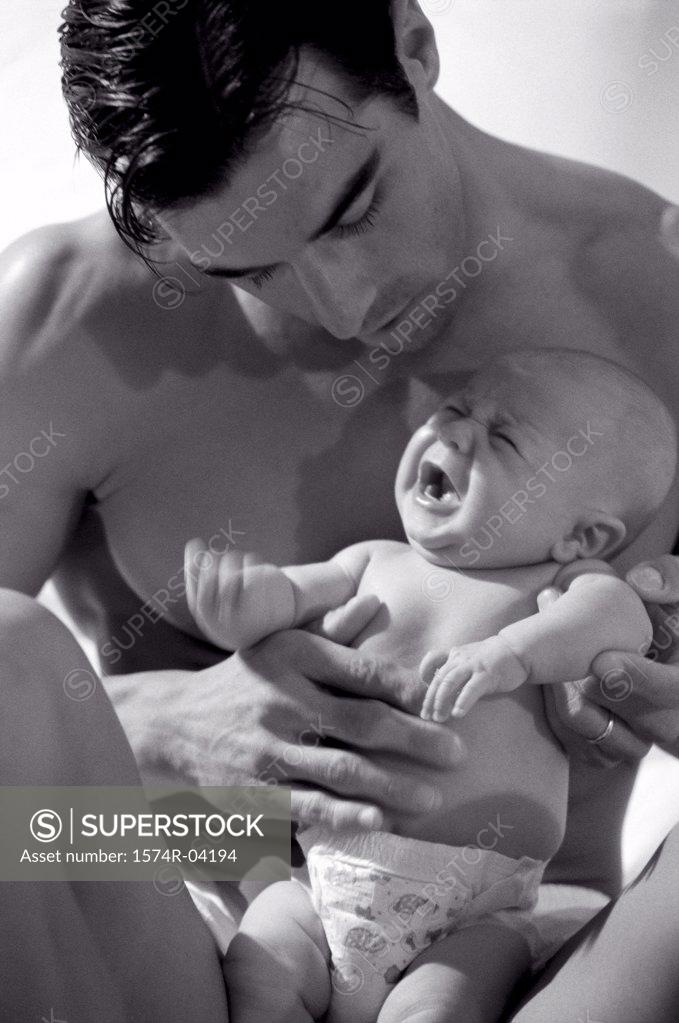 Stock Photo: 1574R-04194 Close-up of a father holding his baby boy