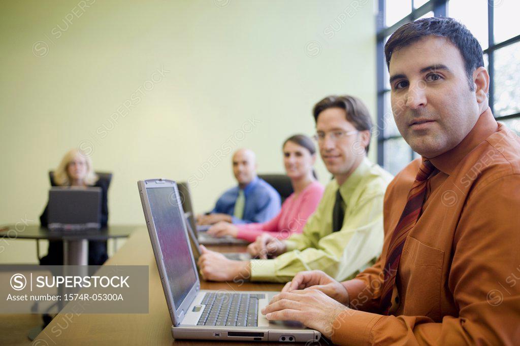 Stock Photo: 1574R-05300A Portrait of a group of business executives in a conference