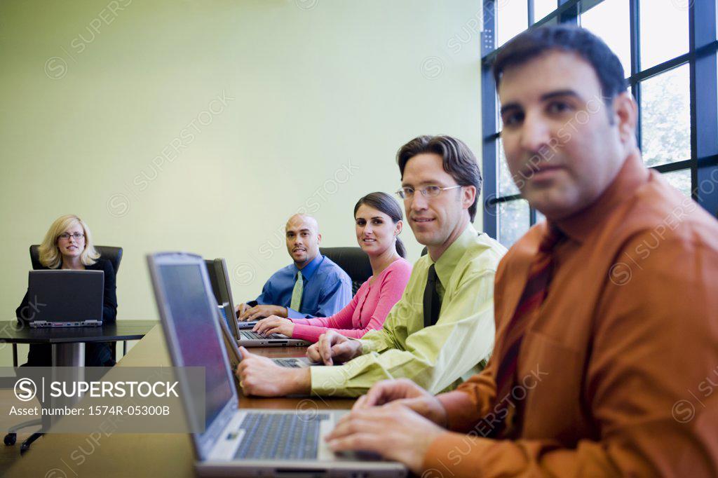 Stock Photo: 1574R-05300B Portrait of a group of business executives in a conference