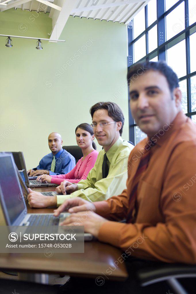 Stock Photo: 1574R-05302B Business executives sitting in a conference room