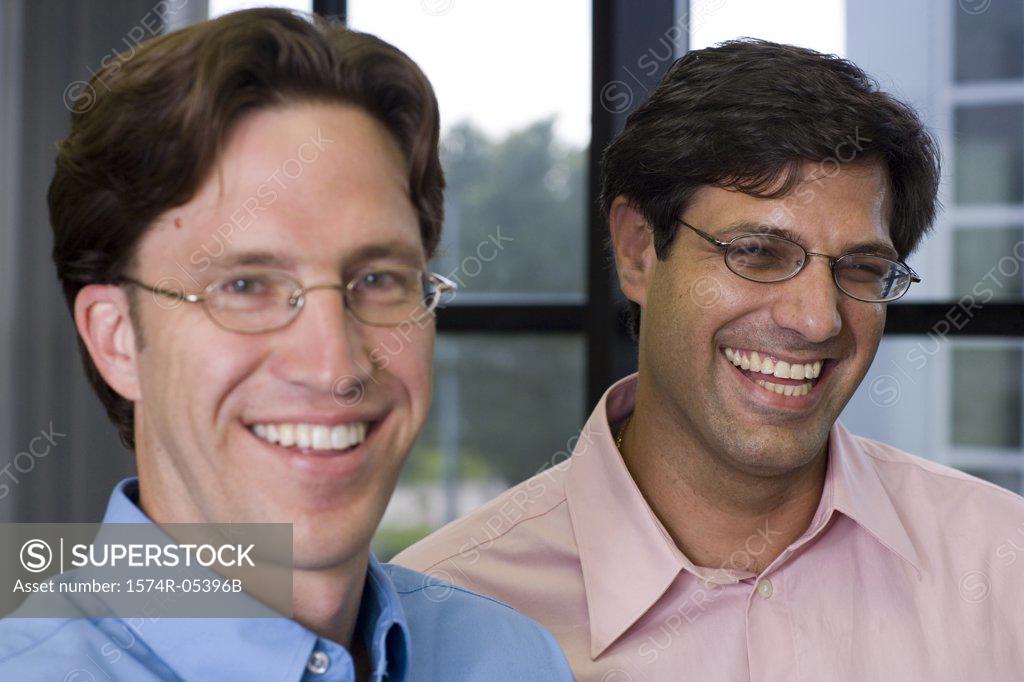 Stock Photo: 1574R-05396B Portrait of two businessmen laughing in an office