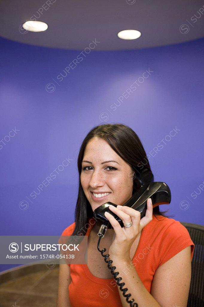 Stock Photo: 1574R-05413B Portrait of a businesswoman talking on a telephone