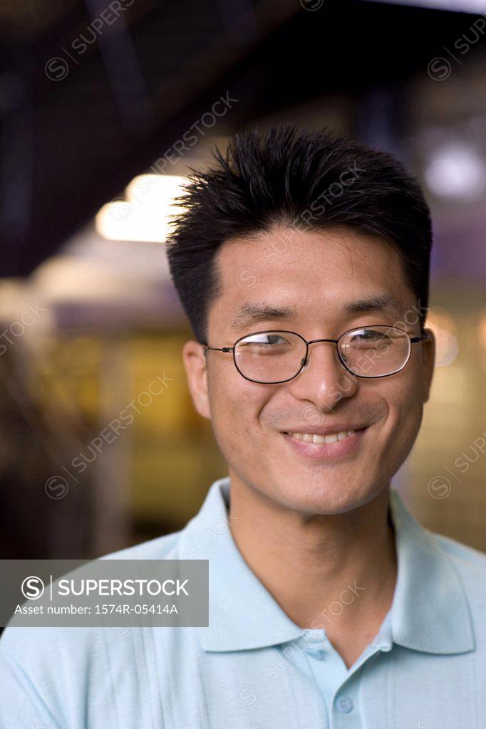 Stock Photo: 1574R-05414A Portrait of a businessman smiling in an office