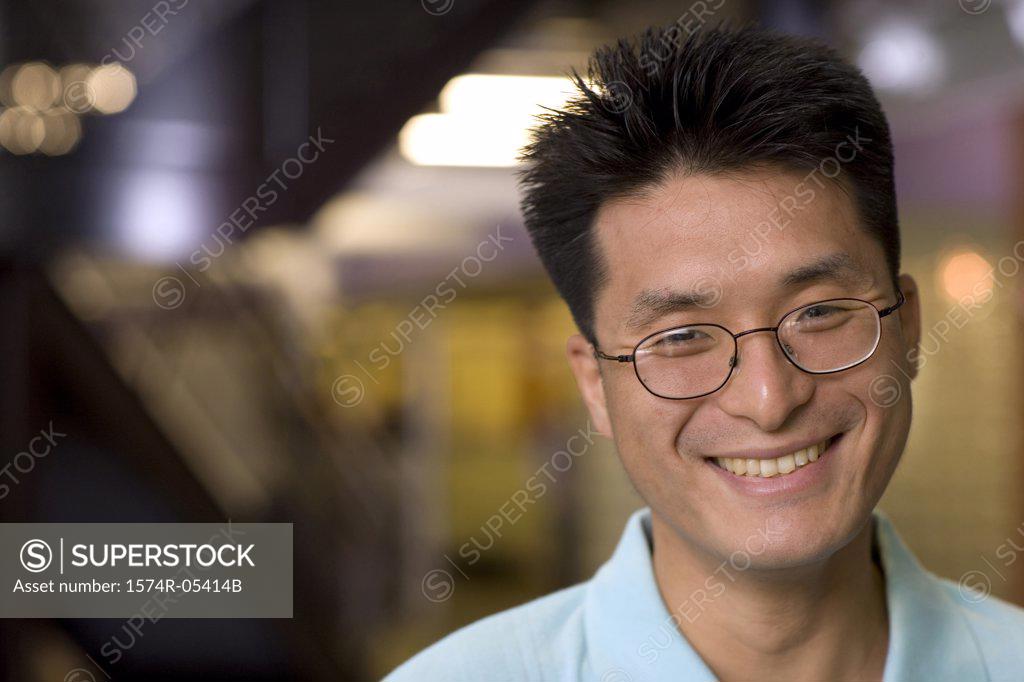 Stock Photo: 1574R-05414B Portrait of a businessman smiling in an office