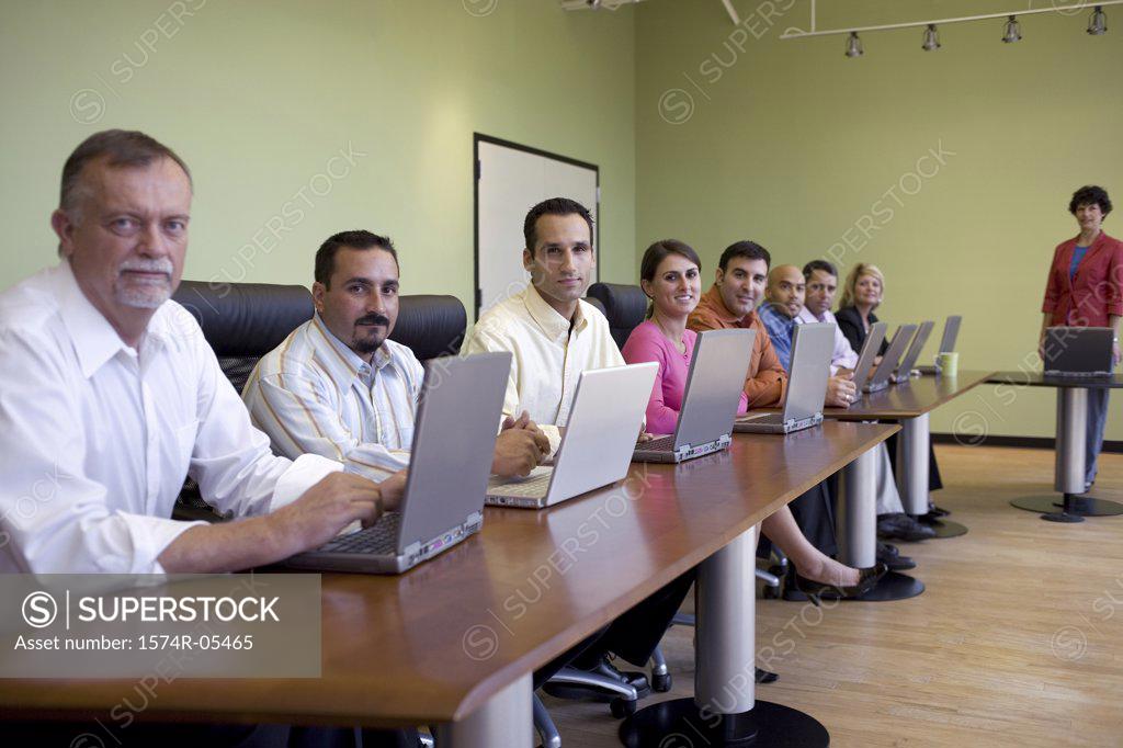 Stock Photo: 1574R-05465 Portrait of a group of business executives in a conference
