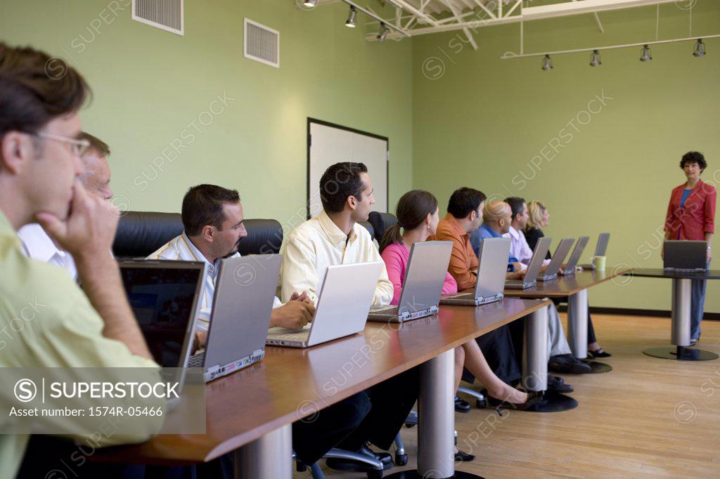 Stock Photo: 1574R-05466 Group of business executives in a conference