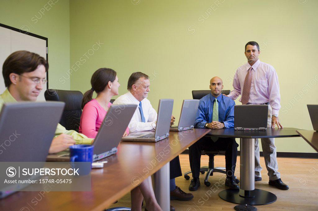 Stock Photo: 1574R-05475 Group of business executives in a conference