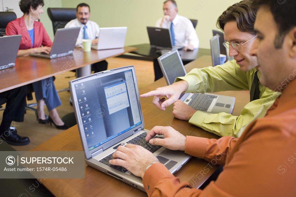 Stock Photo: 1574R-05486 Group of business executives in a conference