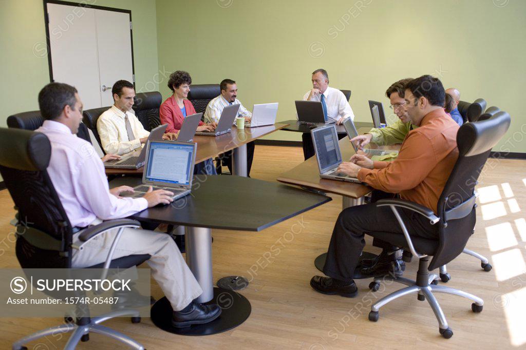 Stock Photo: 1574R-05487 Group of business executives in a conference