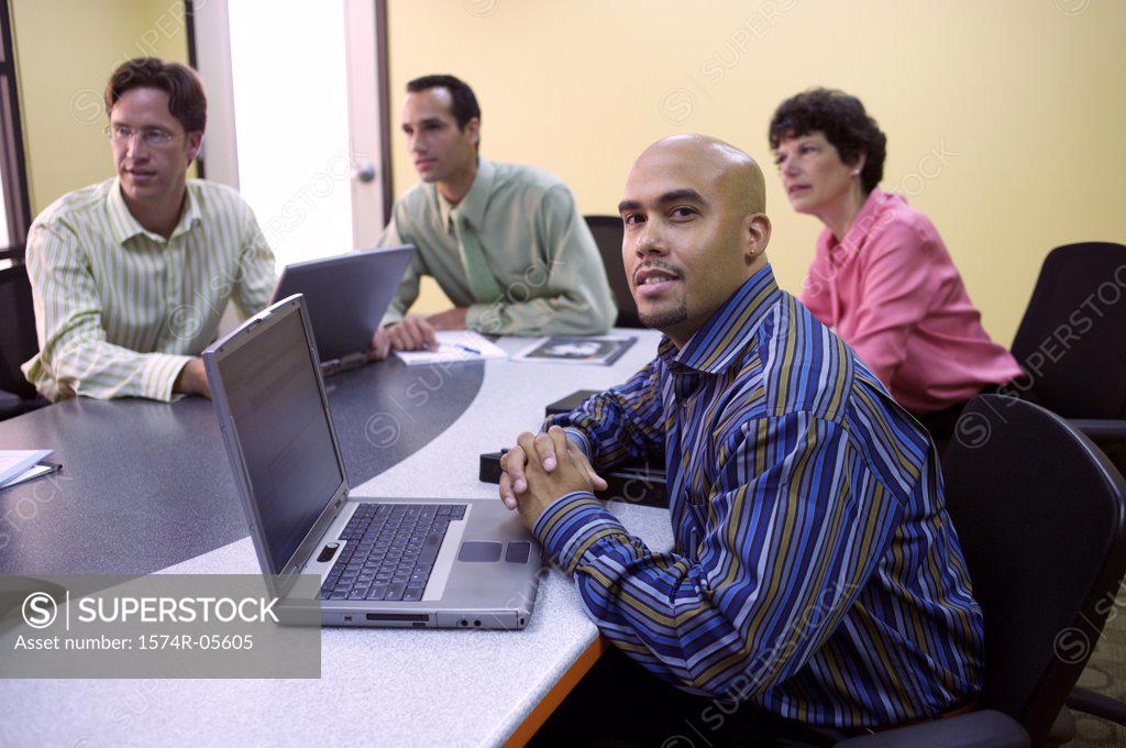Stock Photo: 1574R-05605 Group of business executives in a conference