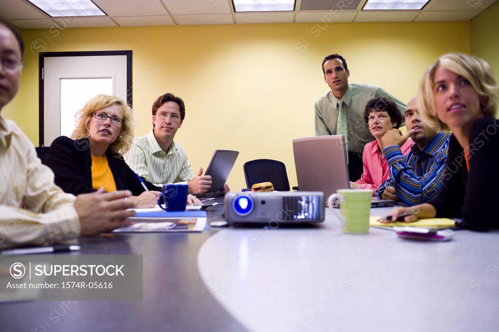 Stock Photo: 1574R-05616 Group of business executives in a conference