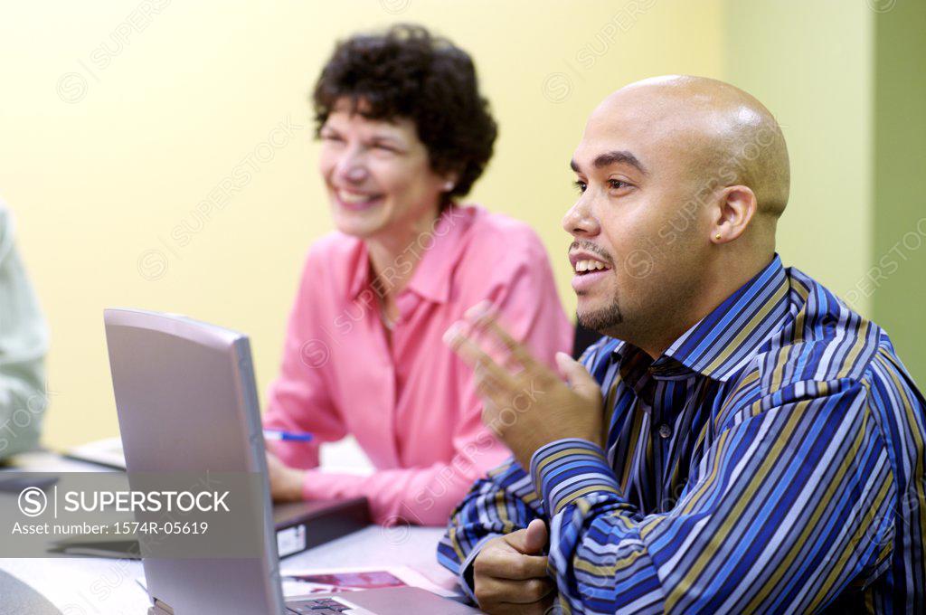 Stock Photo: 1574R-05619 Businessman and a businesswoman in a conference