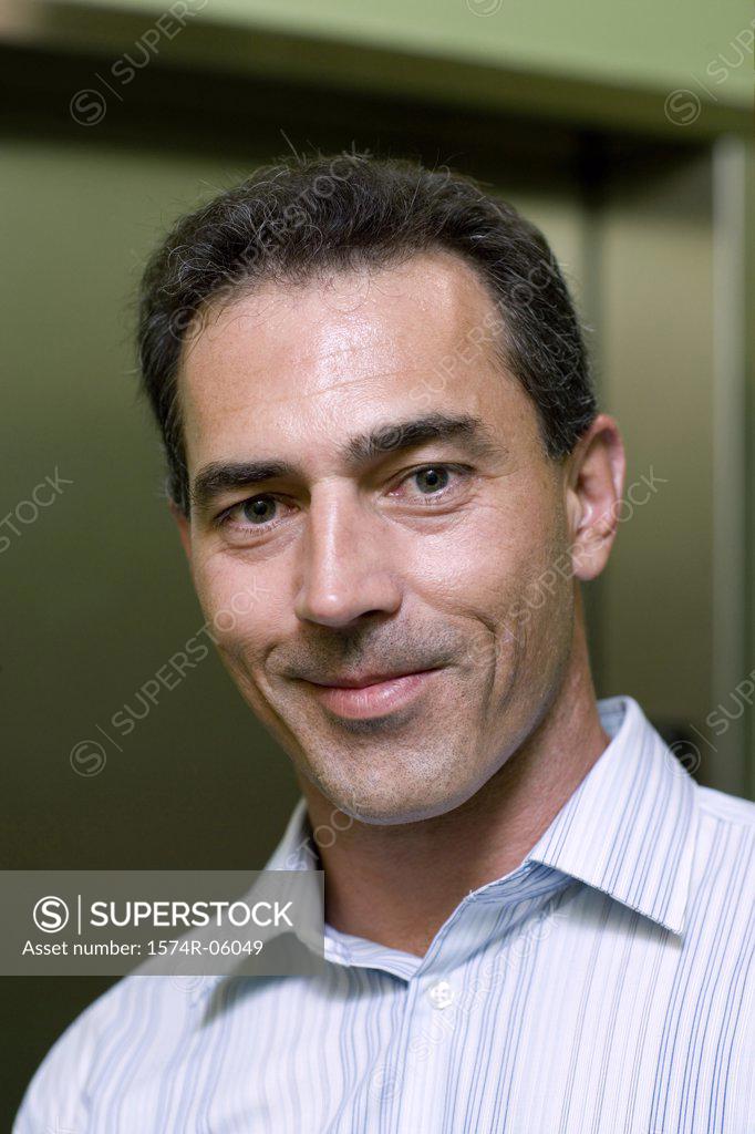 Stock Photo: 1574R-06049 Portrait of a businessman in an office