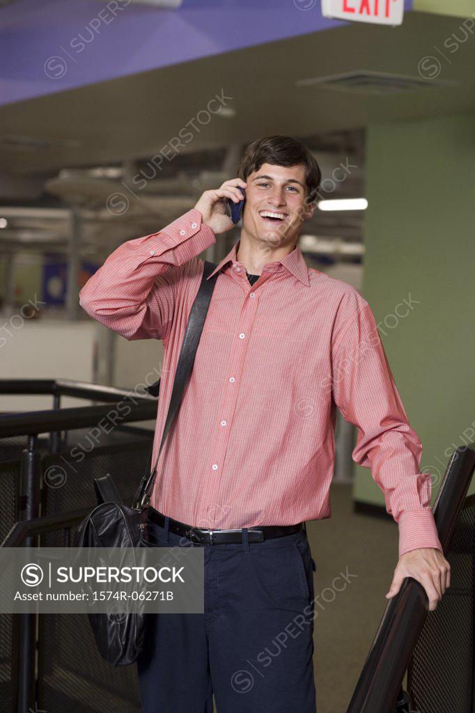 Stock Photo: 1574R-06271B Portrait of a businessman talking on a mobile phone in an office