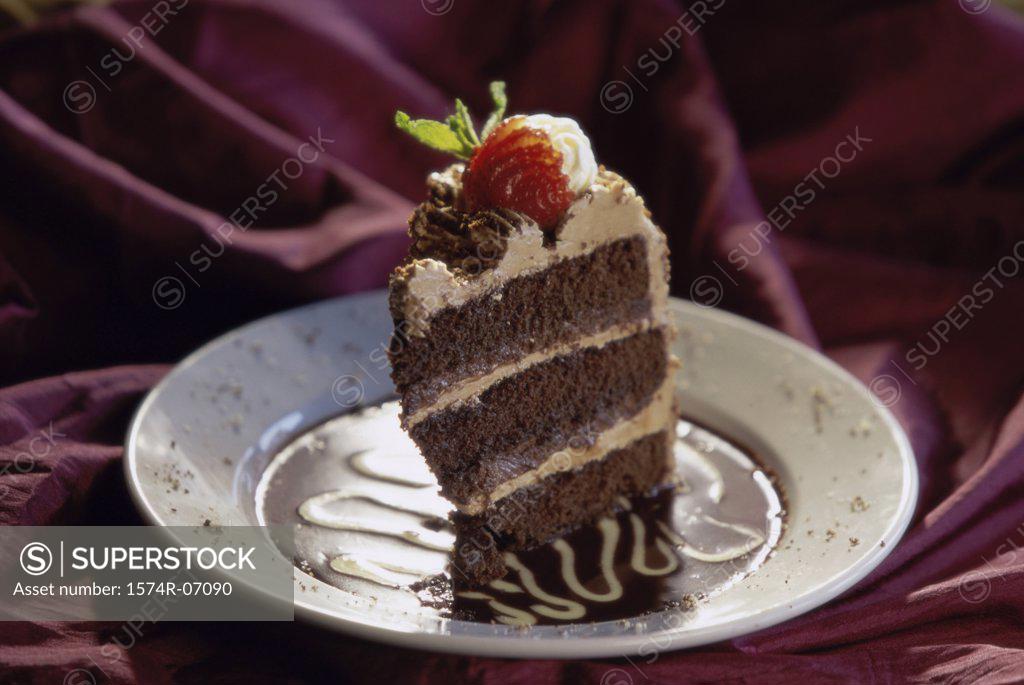 Stock Photo: 1574R-07090 Slice of fruit cake on a plate