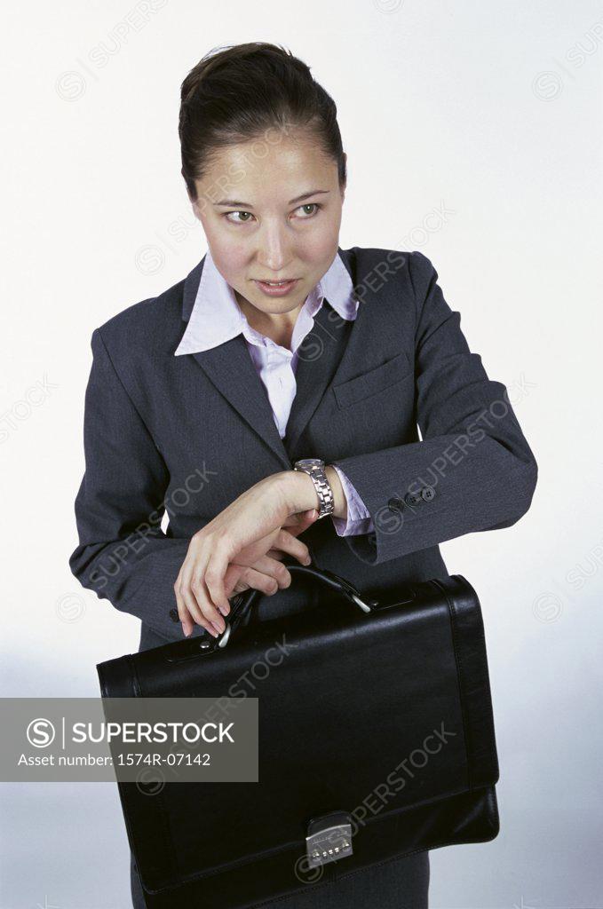 Stock Photo: 1574R-07142 Businesswoman holding a briefcase