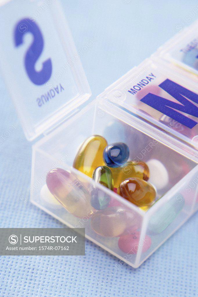 Stock Photo: 1574R-07162 Close-up of capsules and tablets in a pill box
