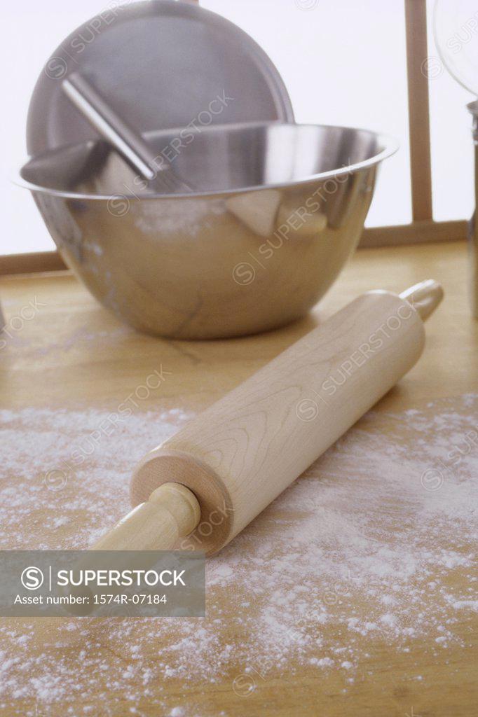 Stock Photo: 1574R-07184 Close-up of a rolling pin near a mixing bowl