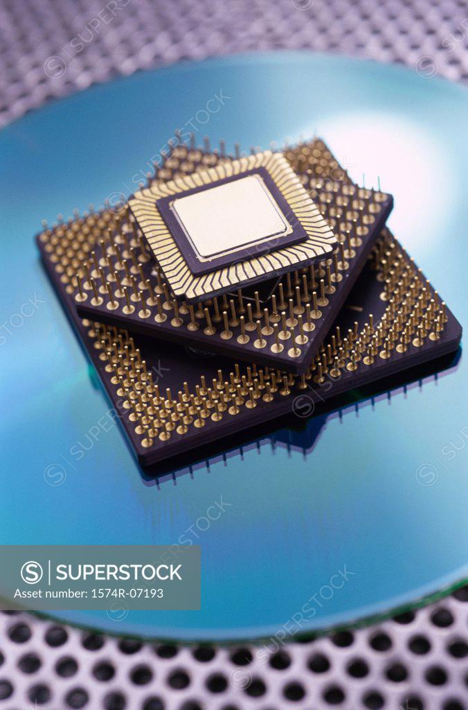 Stock Photo: 1574R-07193 Three computer chips placed one on top of the other