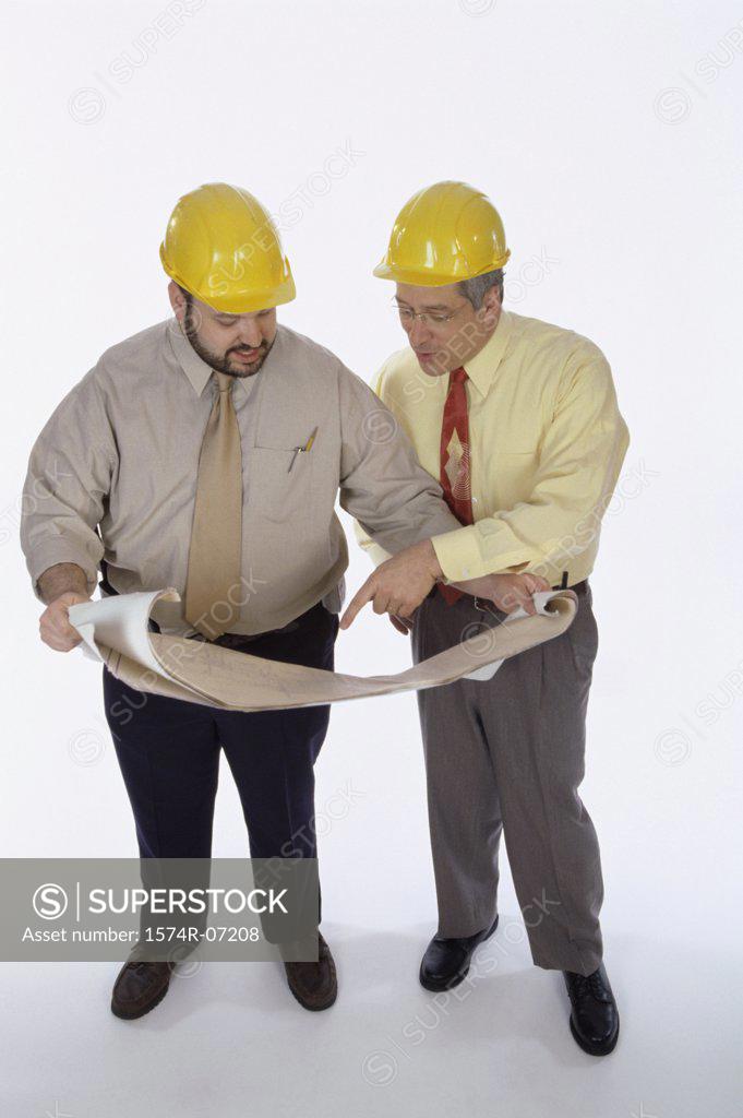 Stock Photo: 1574R-07208 High angle view of two foremen working on blueprints