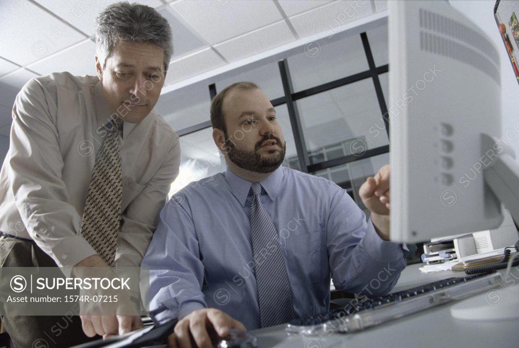 Stock Photo: 1574R-07215 Two businessmen in an office