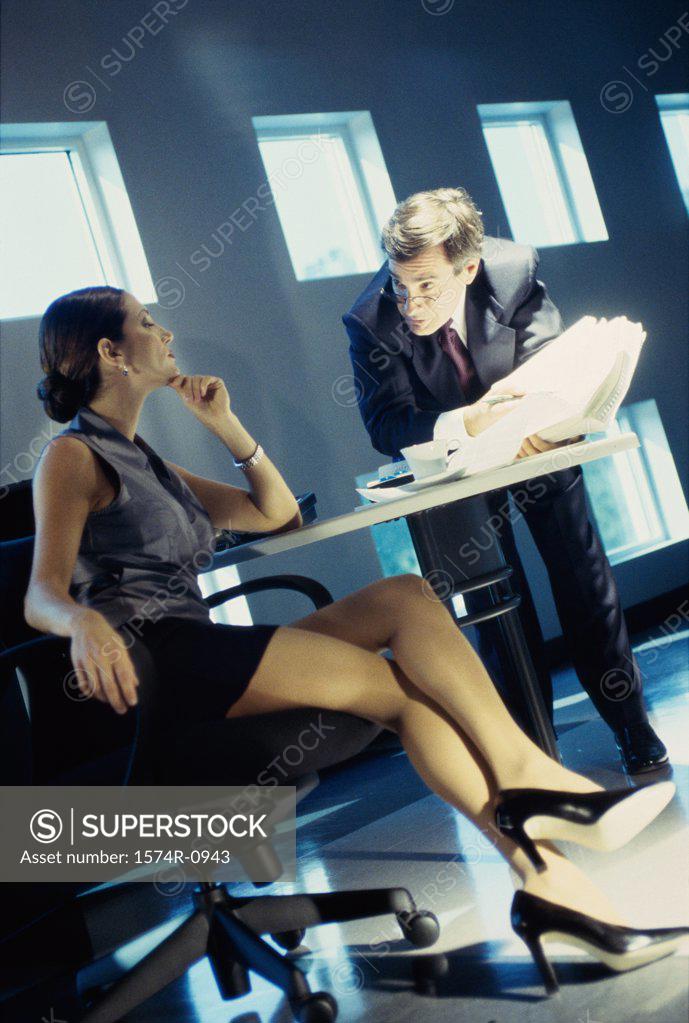 Stock Photo: 1574R-0943 Businessman and businesswoman in a meeting