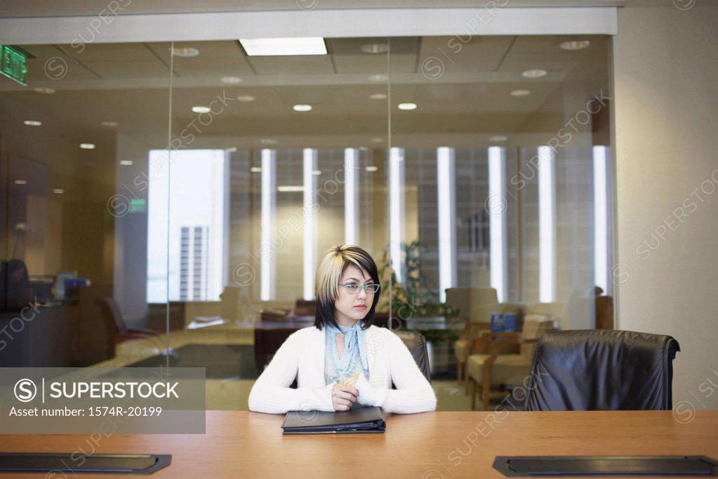Stock Photo: 1574R-20199 Businesswoman sitting in an office