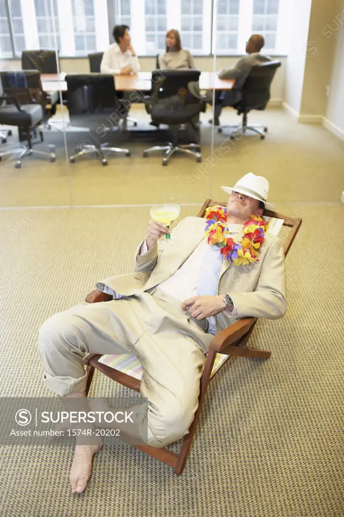 High angle view of a businessman relaxing in an office