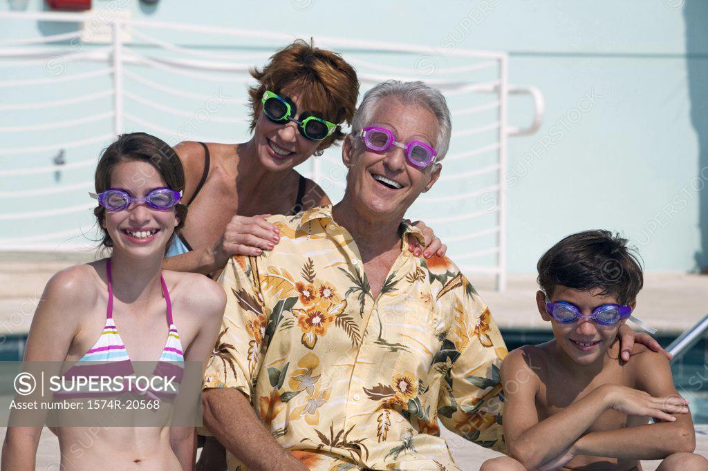 Stock Photo: 1574R-20568 Senior couple smiling with their grandson and granddaughter