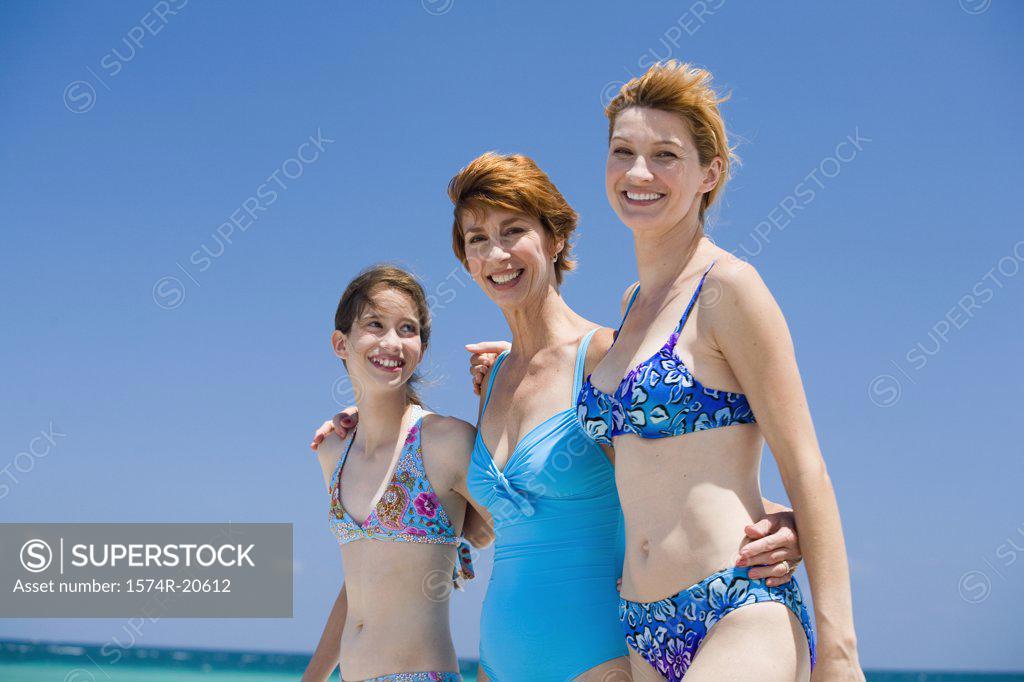 Stock Photo: 1574R-20612 Side profile of a girl standing with her mother and grandmother