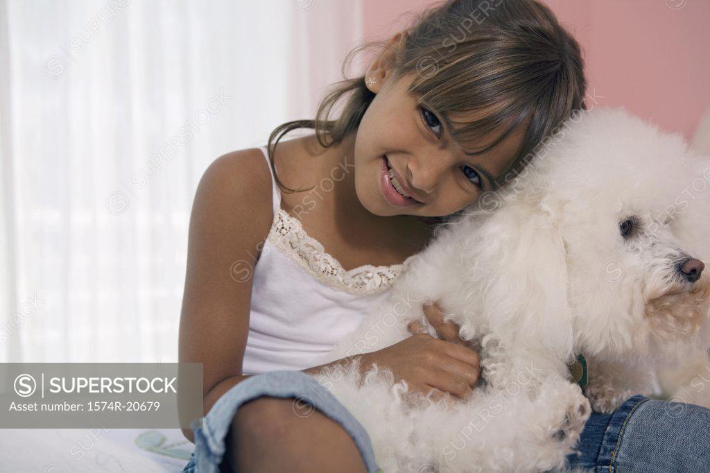 Stock Photo: 1574R-20679 Portrait of a girl hugging her dog and smiling