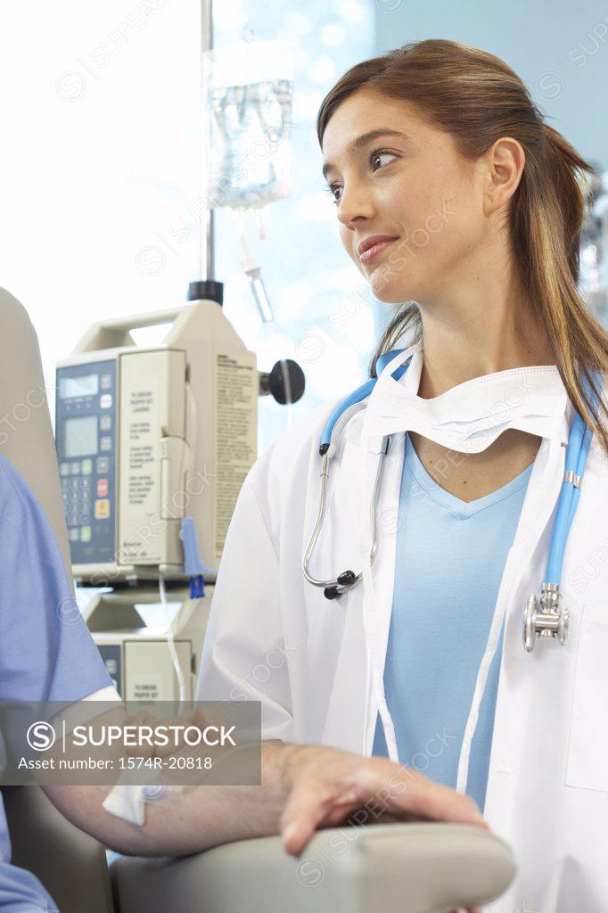 Stock Photo: 1574R-20818 Close-up of a female doctor examining a male patient