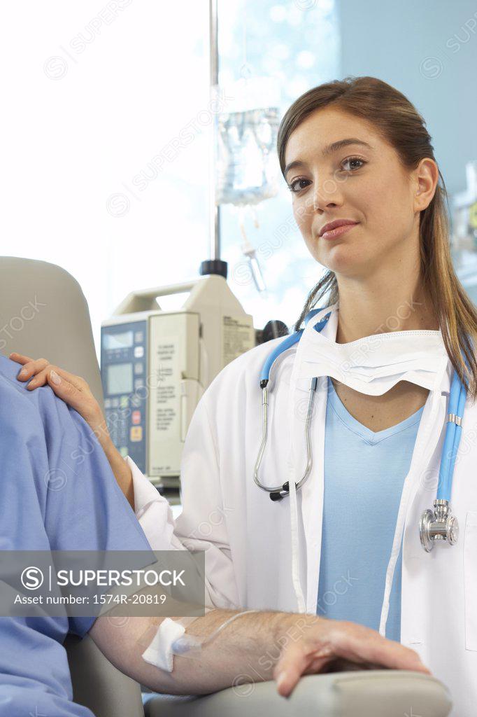Stock Photo: 1574R-20819 Portrait of a female doctor examining a male patient